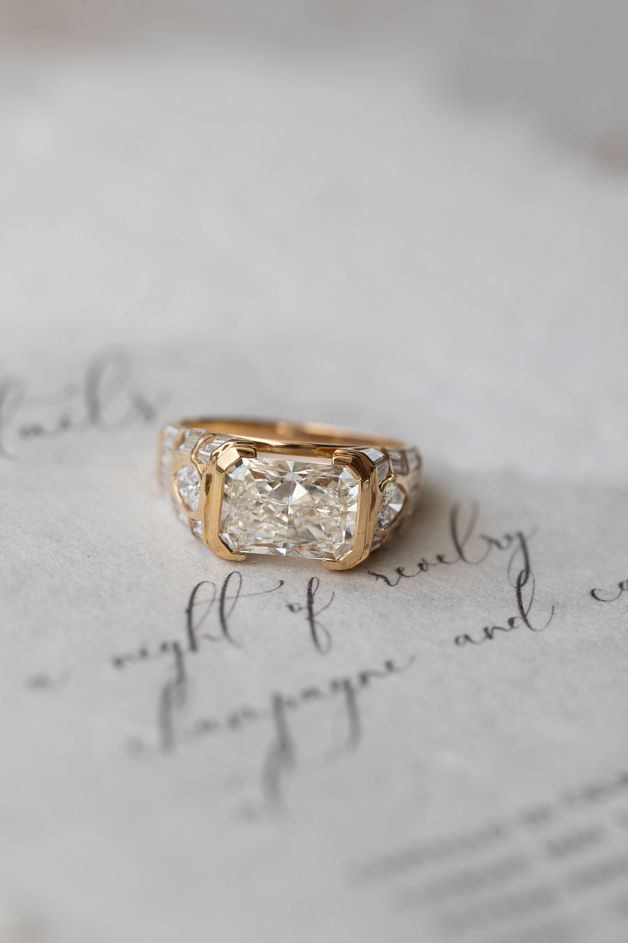 A White November ring resting on a handwritten letter.