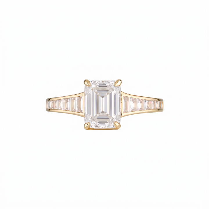 Empire Ring front on with I colour emerald cut centre diamond and I colour baguette shoulders in 18k yellow gold