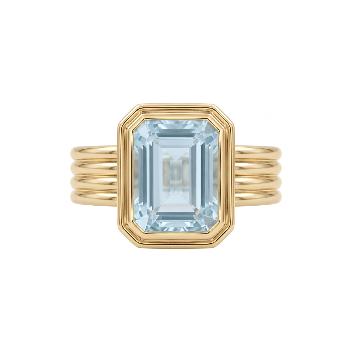 Rebecca Ring in 9k yellow gold, emerald cut blue topaz bezel set on a fluted band
