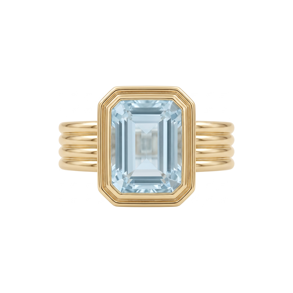 Rebecca Ring in 9k yellow gold, emerald cut blue topaz bezel set on a fluted band
