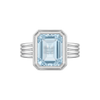 Rebecca Ring in rhodium plated 9k white gold, emerald cut blue topaz bezel set on a fluted band