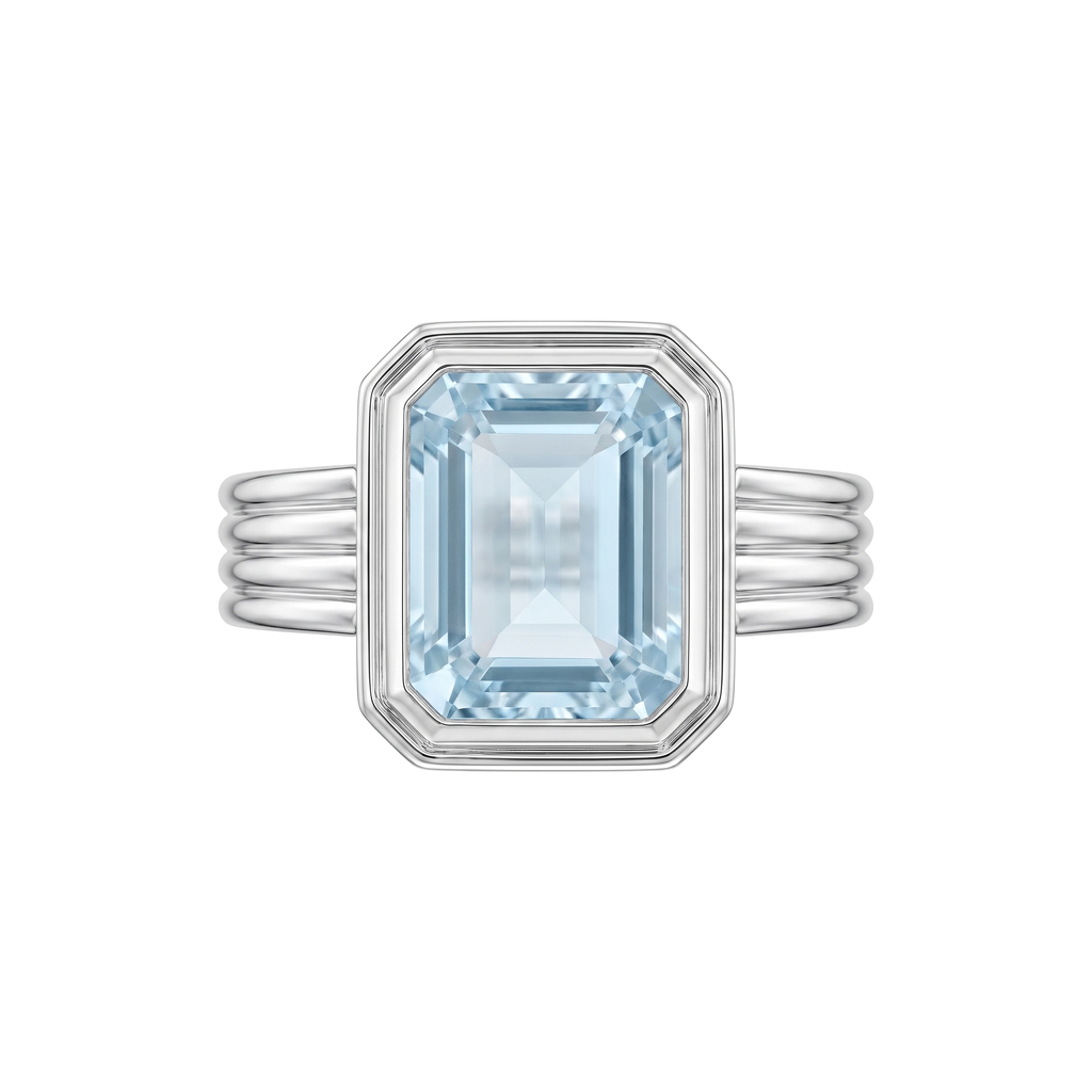 Rebecca Ring in rhodium plated 9k white gold, emerald cut blue topaz bezel set on a fluted band