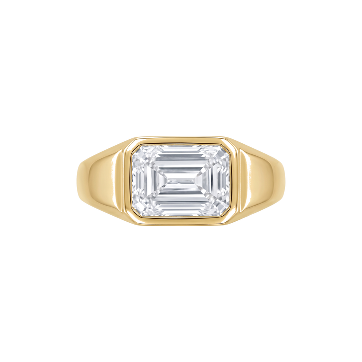 ODEON RING in 18k yellow gold, emerald cut lab grown diamond flush bezel set into a heavy tapered band
