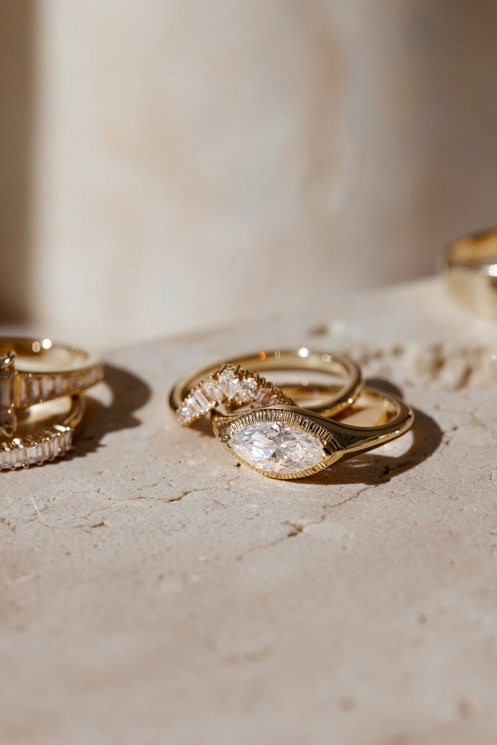 A ring held under a jeweller's loupe on the bench.