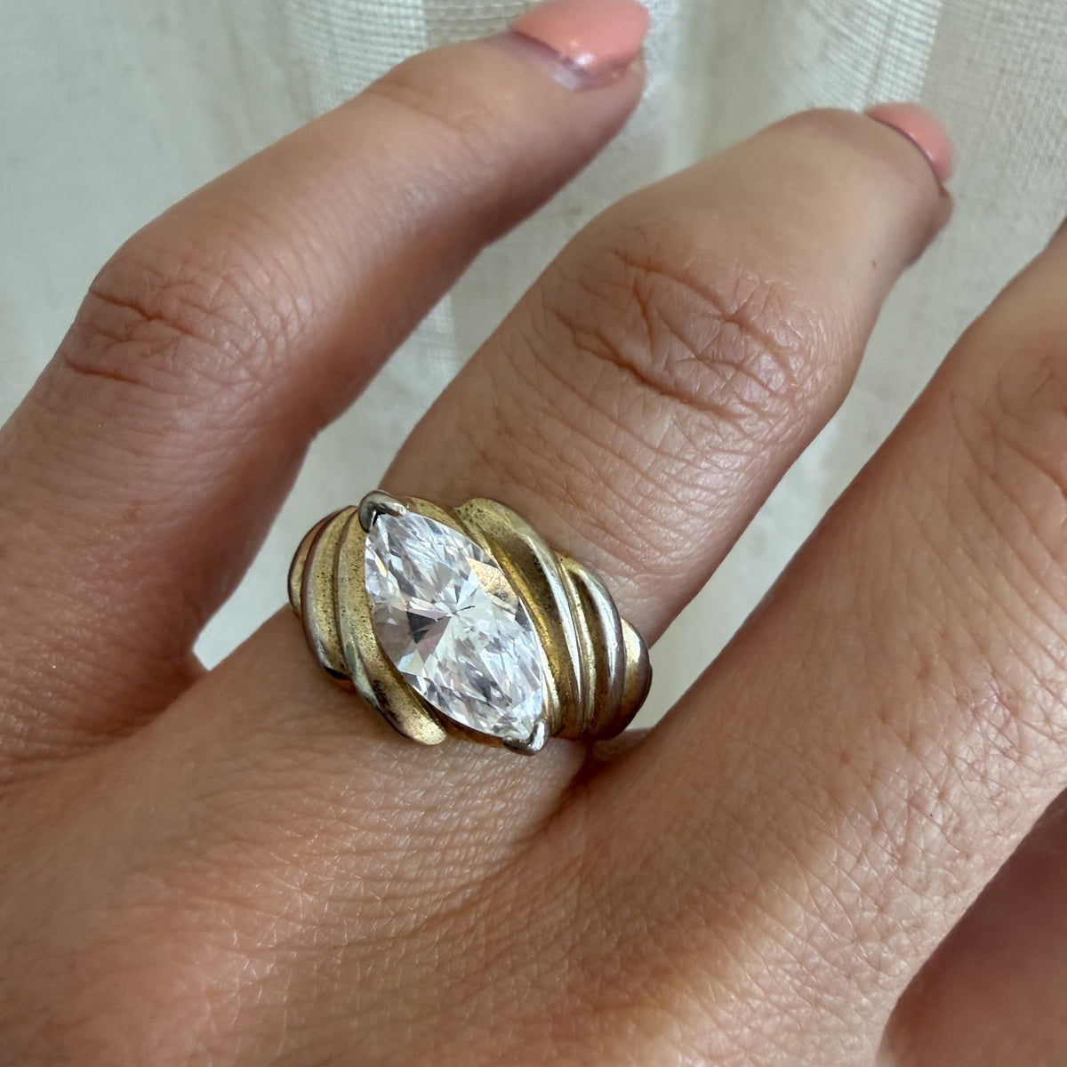 THEA RING worn on the hand, yellow gold with a 3ct marquise cut lab grown diamond - White November