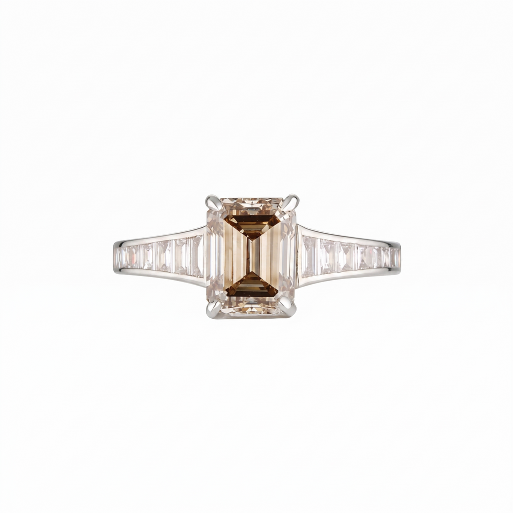 Empire Ring front on with champagne emerald cut centre diamond in 18k white gold with channel-set baguette diamond shoulders