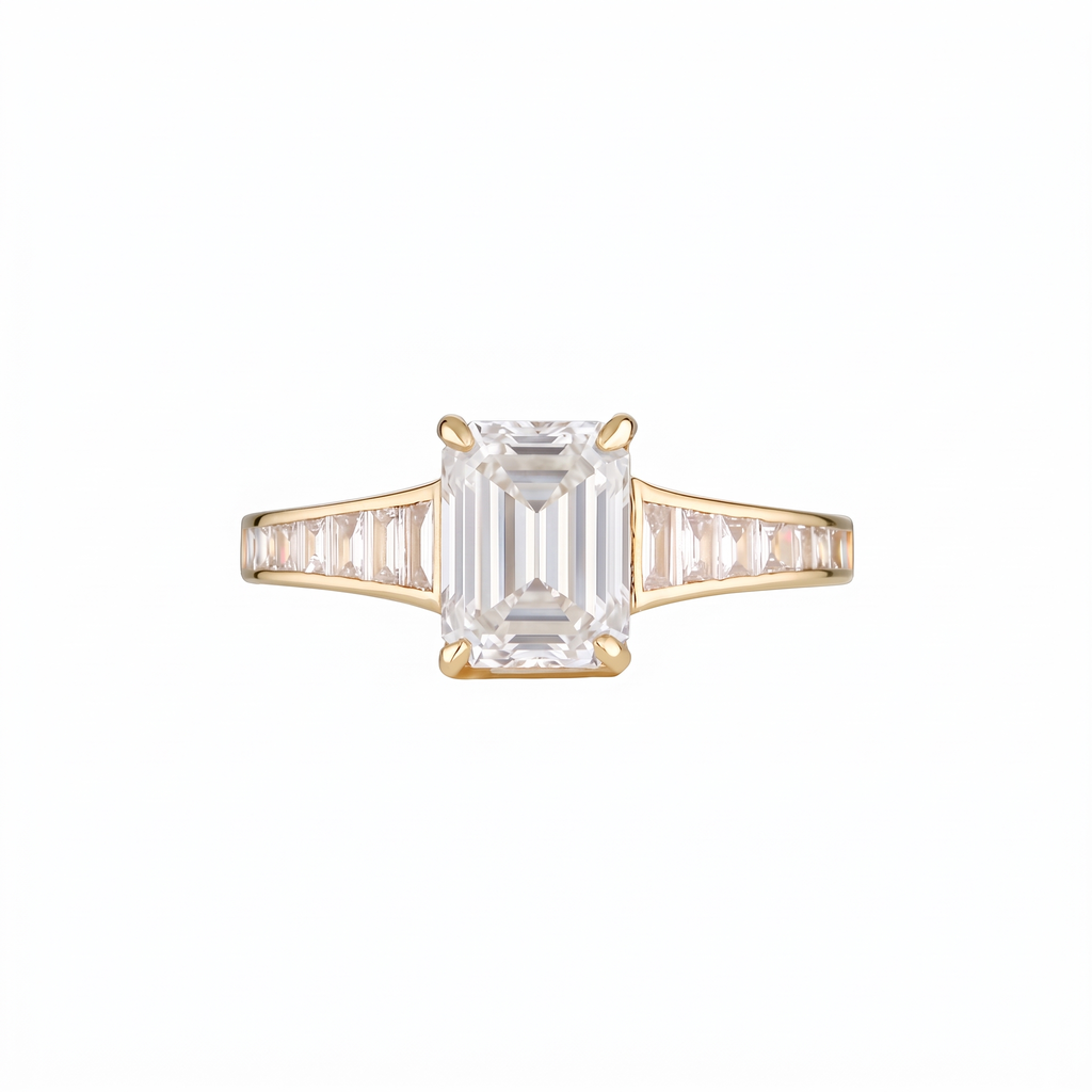 Empire Ring front on with I colour emerald cut centre diamond and I colour baguette shoulders in 18k yellow gold