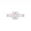 Empire Ring front on with white lab grown emerald cut centre diamond in 18k white gold with channel-set baguette diamond shoulders