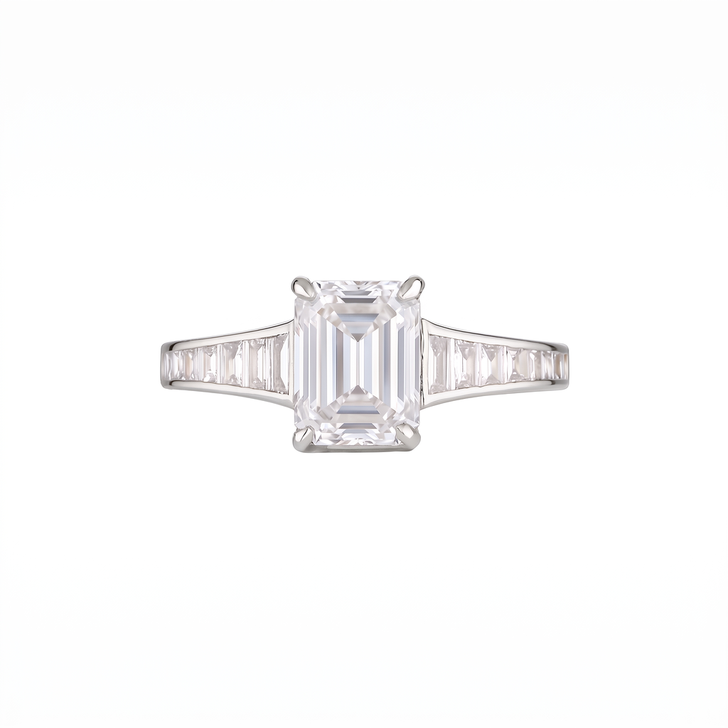 Empire Ring front on with white lab grown emerald cut centre diamond in 18k white gold with channel-set baguette diamond shoulders