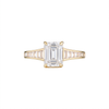 Empire Ring with white emerald cut diamond centre stone in 18k yellow gold with channel-set white baguette diamond shoulders